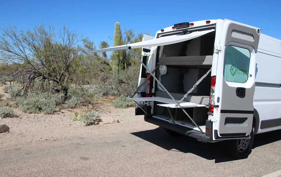 The Bunkhouse_ table and awning set up in back